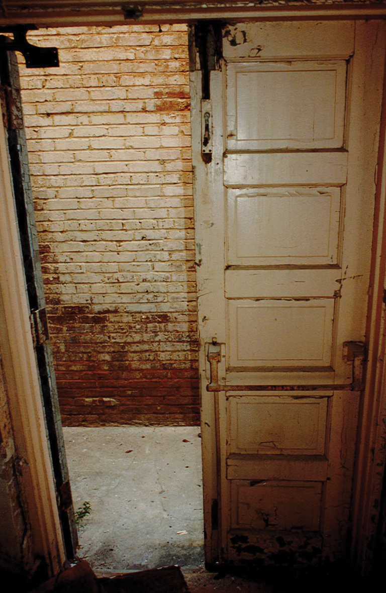 Late 1990s, Original alley entrance door during demolition.